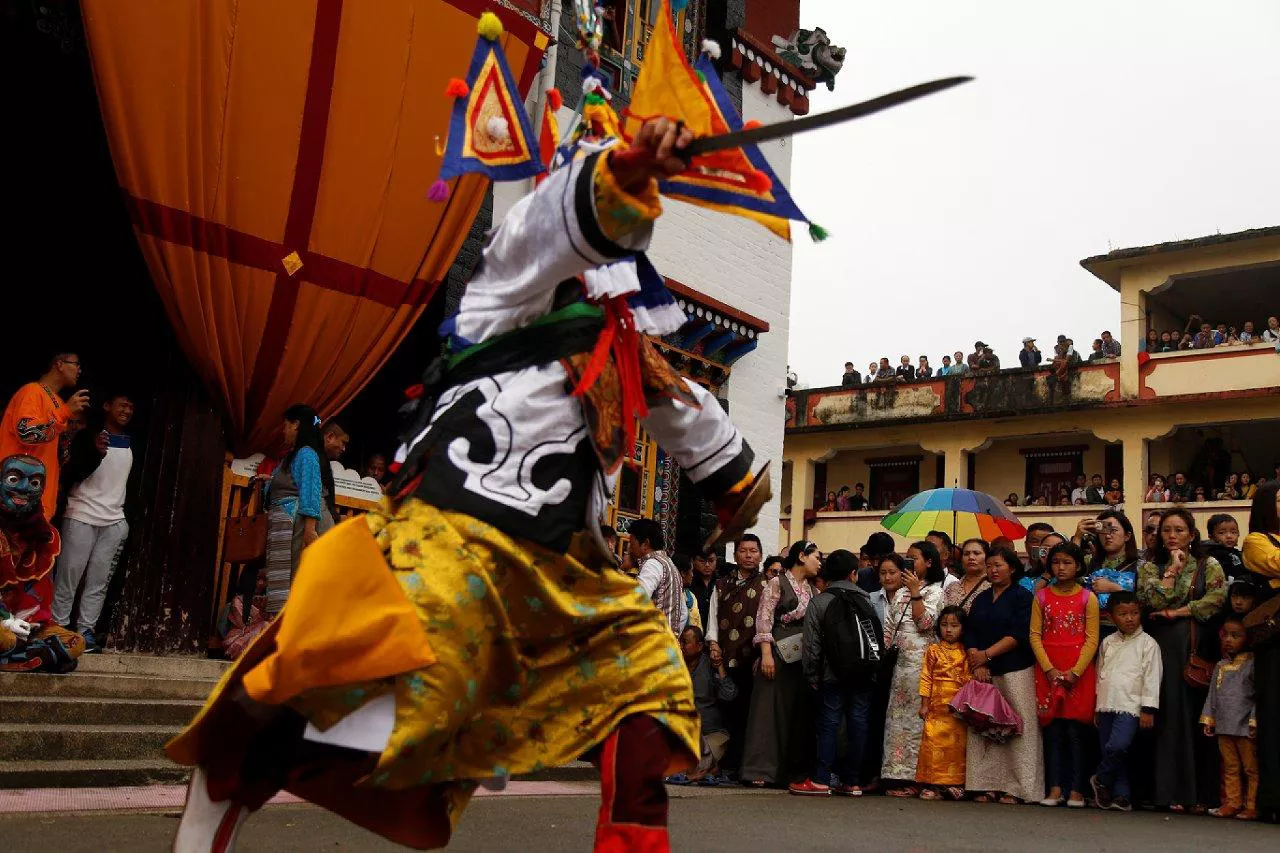 Man dancing carrying sword